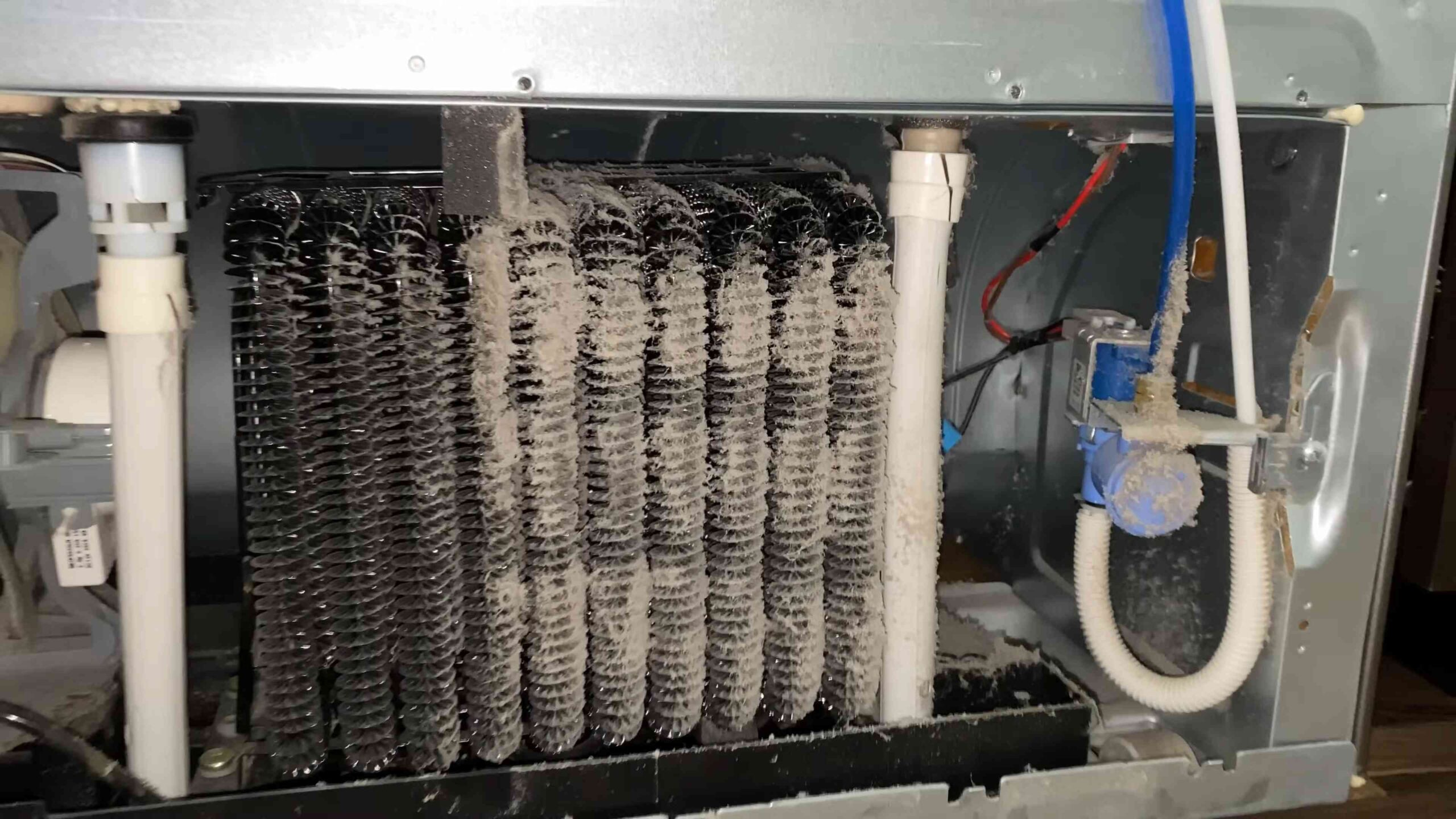 Clean fridge coils vacuum trick